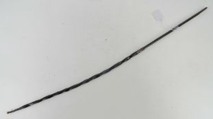 A twisted whalebone handle probably for a coaching whip having white metal fittings, a/f.