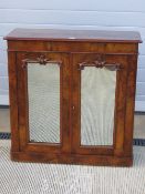 A good walnut half veneered two door floor standing cabinet,
