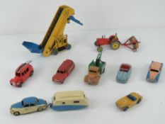 A quantity of Dinky Toys vehicles by Meccano including Austin Atlantic, Rover 75, Comer, Ford Sedan,