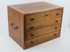 A tabletop chest of four drawers in walnut, collectors / curiosity cabinet,