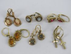 Six pairs of vintage rolled gold earrings including cameos, citrine coloured stone, crucifix, etc.