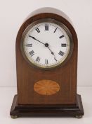 An Edwardian mantle clock having inlaid boxwood,