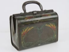 A vintage Huntley & Palmers biscuit tin in the form of a Gladstone style handbag having floral