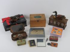 A music box in the form of a coffer chest, together with vintage tins, contemporary pill boxes,