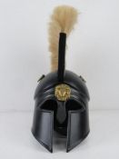 A reenactor or display piece Spartan helmet with natural coloured plume over.