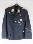 A repro Luftwaffe Condor Legion tunic with awards (size L).