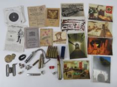 A quantity of assorted militaria inc; inert ammunition; identity card,