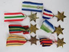 Six WWII British medals being Italy Star, Burma Star, France and Germany Star, Atlantic Star,