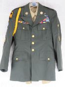 A WWII US Infantry Jacket with insignia, size 36 regular, together with a US parade shirt.