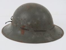 A WWII British Zuckerman helmet, stamped (MPR?), leather and canvas lining a/f.