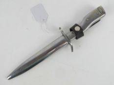 A German bayonet having steel grip and scabbard with leather frog,