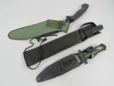A contemporary survival knife having saw back blade and handle opening to reveal matches,