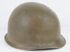 A WWII US M1 1942 helmet,