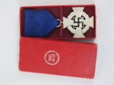A WWII German 25 Year Faithful Service medal in box.