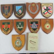 Nine assorted regiment plaques and book of naval slang 'Not Enough Room To Swing A Cat'.