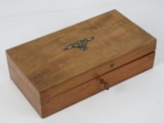 A vintage box with key bearing SS badge upon.