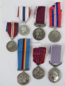 A quantity of assorted British George VI and Elizabeth II unengraved medals with ribbons.