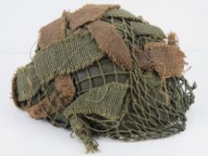 A reproduction British Paratrooper's helmet and liner.
