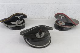 Three reproduction German WWII officers caps, size 57, 56 and 56.