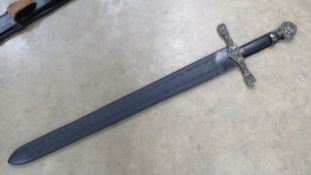A reenactor Medieval style sword measuring 41.5 in length.