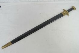 A re-enactor's Medieval style sword with leather covered grip, brass pommel and scabbard.