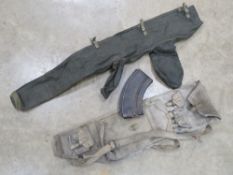 A Bren spare barrel bag, a Bren mag, two inert rounds and a Bren cover.