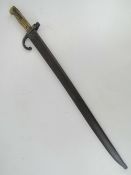 A French Chassepot 1869 bayonet and scabbard, engraved to back edge, numbered 17829,