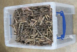 A box of inert spent 5.56 blank shell cases.
