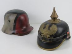A reproduction WWI German pickelhaube helmet and liner,