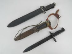 A Denix Spain reproduction black painted bayonet.