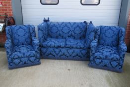 A two seater Knole drop arm sofa with loose cushions,