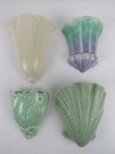 A quantity of assorted ceramic wall pockets; Dartmouth floral pocket,
