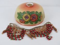 An early 20thC hand painted milk glass light shade marked 'Folly' upon, slightly a/f.