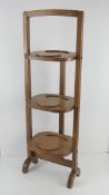 A c1930s oak folding cake / plate stand.