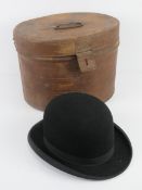 A vintage bowler hat having leather liner marked 'long oval',