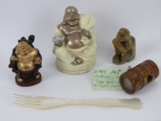 A carved soapstone monkey, a small wooden netsuke inset with stag antler and opposing compass,