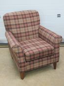 A contemporary armchair by Next in tartan fabric, approx 84 x 84 x 84cm.