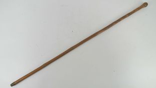 A bamboo swagger stick carved with birds and monkeys upon, 87cm in length.