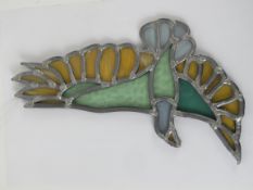 A contemporary leaded glass hanging Peace Dove, 26cm wide.