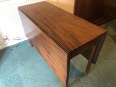A Victorian mahogany drop leaf table having square cut legs, 137 x 106cm extended, 70cm high.