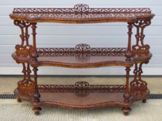 A fine 19thC walnut three tier open fronted buffet or credenza having shaped shelves in fine