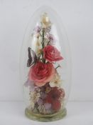 A 'captive garden' by Michael R Curzon having flowers and butterfly within, standing 30cm high.