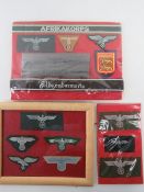 Three WWII German Insignia, one in frame.