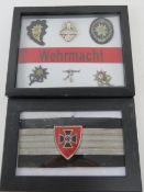 Two framed WWII German insignia.