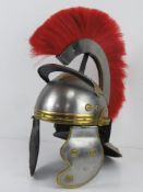 A reenactor or display piece Roman Centurion helmet having red plume upon.