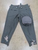 A reproduction WWII German Officers Cap size XL together with a pair of reproduction WWII German