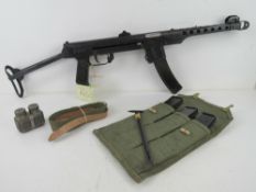 A deactivated PPS43 sub machine gun with 3x spare magazines , 1x magazine pouch, cleaning rod,