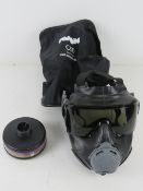 A USA C50 Riot Police Gas mask in bag.