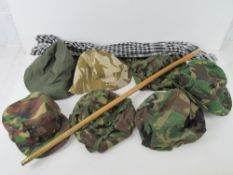 A quantity of assorted militaria; 1x shemagh. 2x British beanie type hats. 1x British cap.