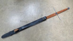 A decorative Claymore sword and scabbard measuring 59 inches.